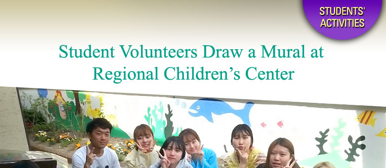 Student volunteers draw a mural at regional children’s center